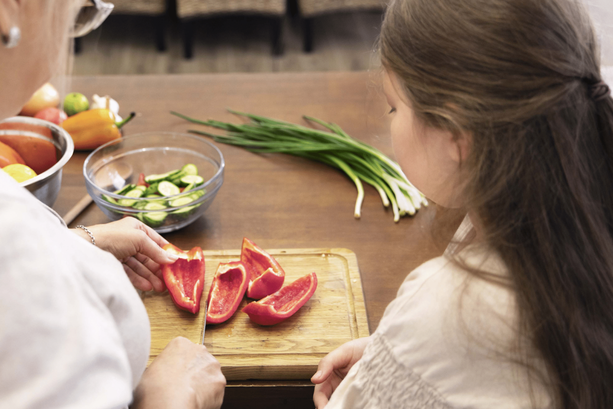 girl-grandma-cooking-together-medium-shot_2000x1333px_web-1200x800.png